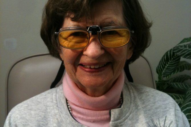 woman wearing prism glasses for low vision